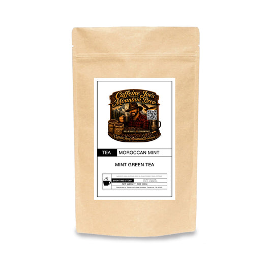 Caffeine Joe's Mountain Brew Moroccan Mint tea in a kraft paper package with fresh mint leaves visible.
